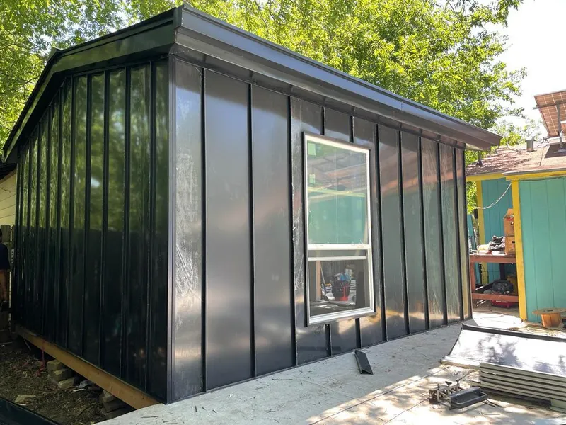 Black standing seam metal wall panels for Roof Inspection in Handy